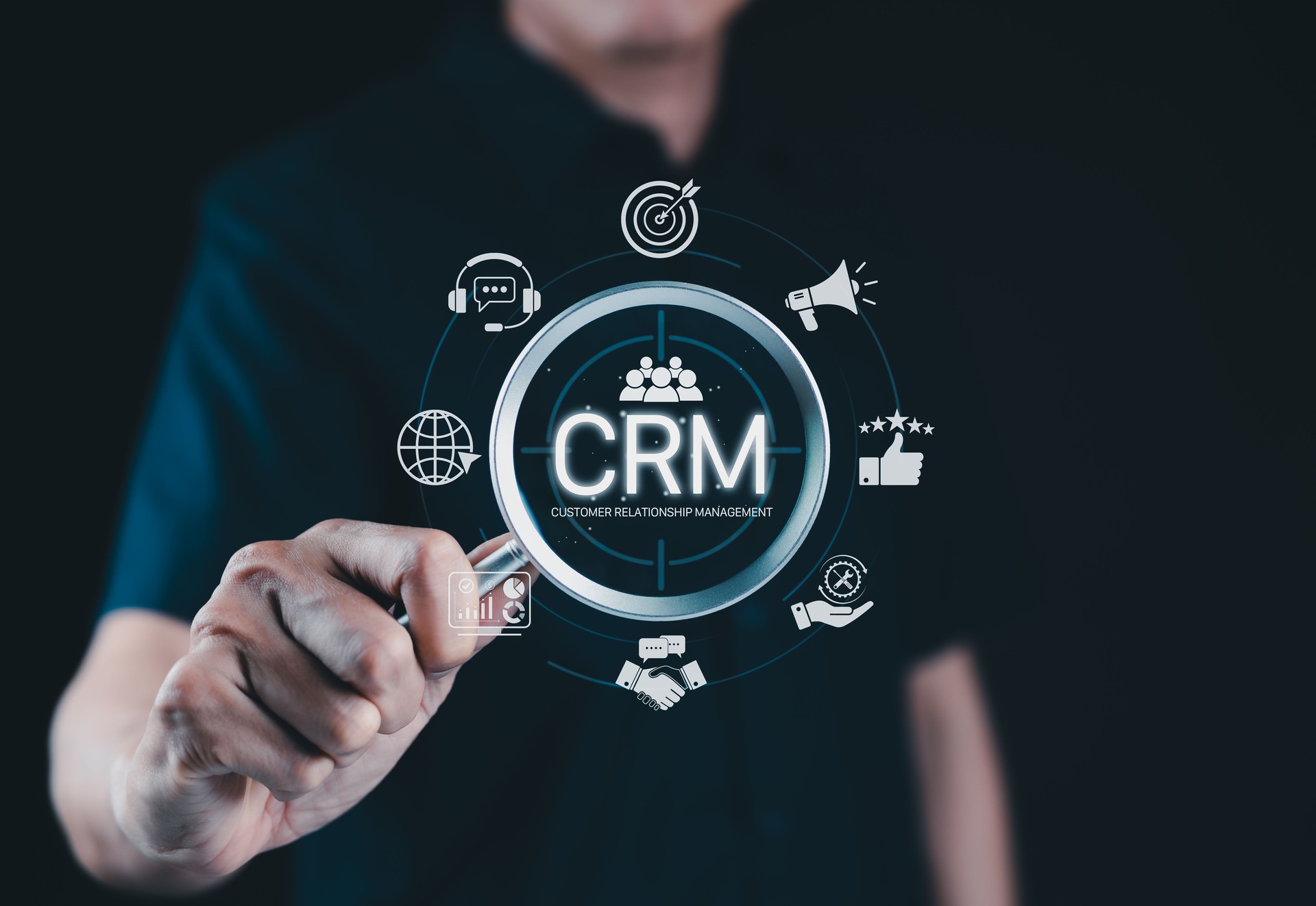 CRM System for Customer Relationship Management. A person interacts with CRM interface icons for support, analytics, marketing, and feedback, illustrating customer relationship management in business.